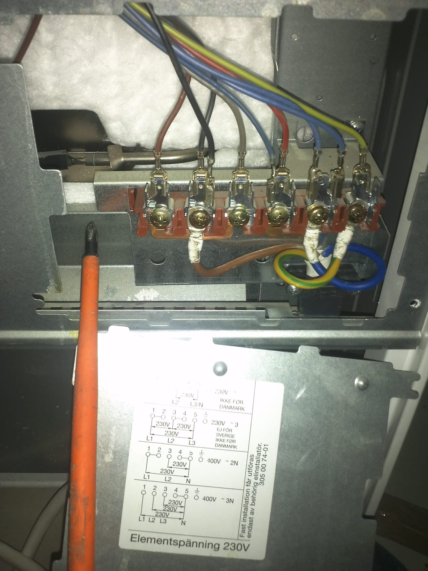 Electrician wiring a stove connection
